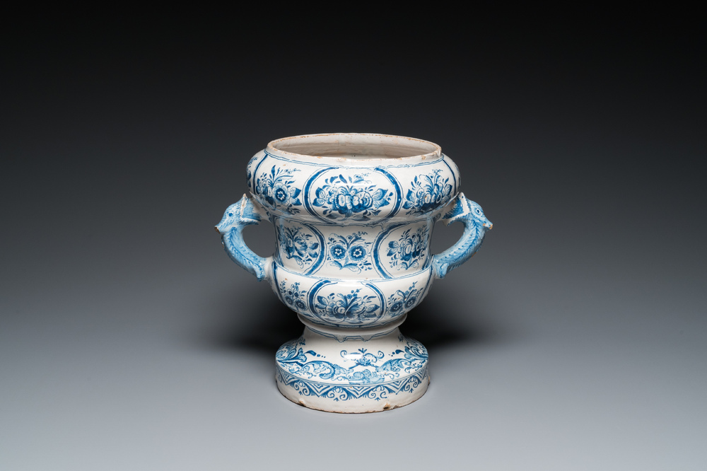 A large blue and white two-handled Frisian Delftware jardini&egrave;re with dolphin handles, Makkum, 18th C.