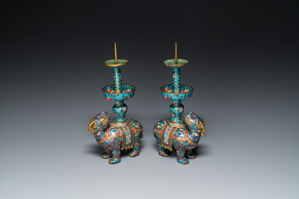 A pair of Chinese cloisonn&eacute; candlesticks in the shape of pixiu, Qing