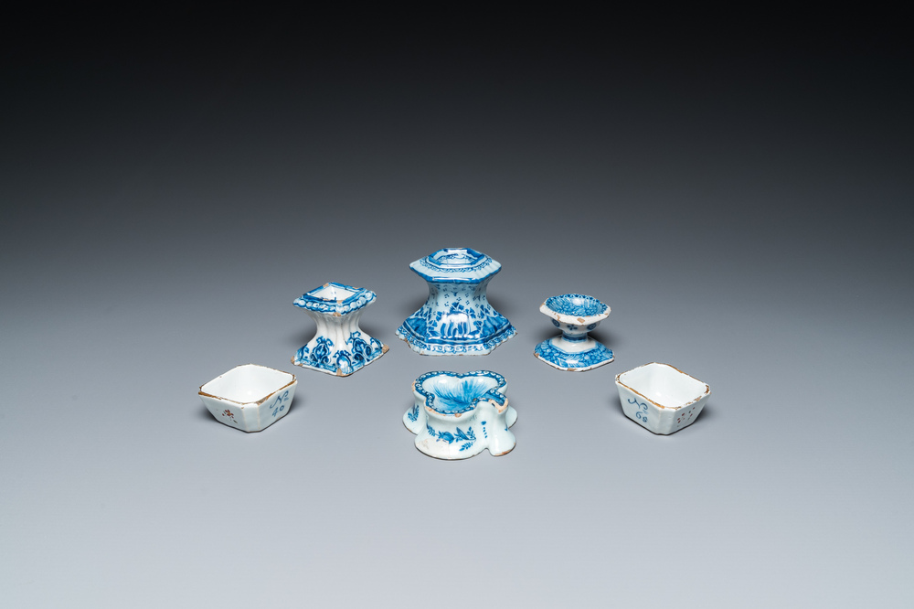 Four blue and white Dutch Delft salts and two small numerically inscribed bowls, 18th C.