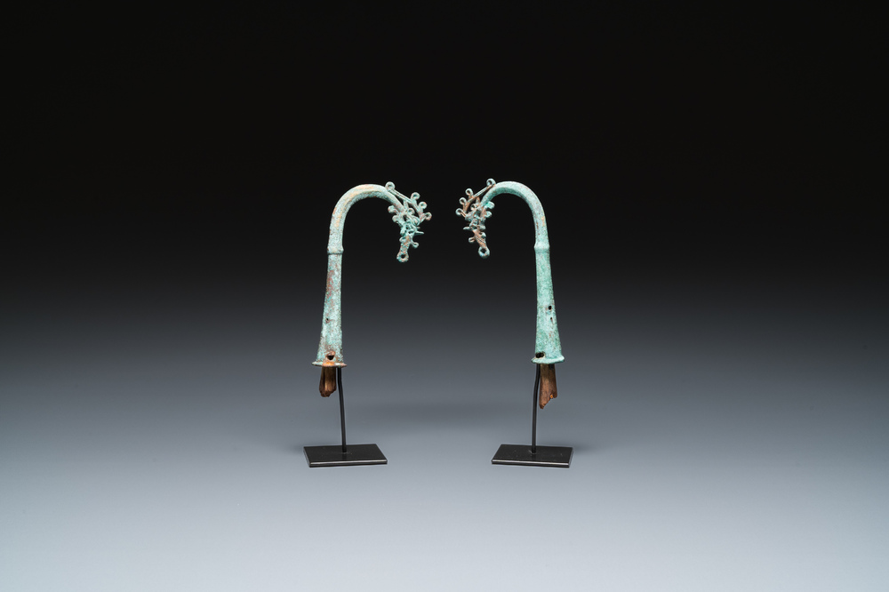 A pair of Chinese bronze finials, Warring States Period, 5th/3rd C. b.C.