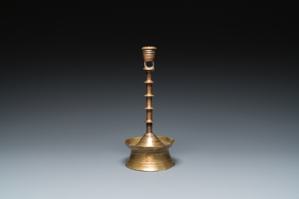 A Dutch or Flemish knotted bronze candlestick, 15/16th C.
