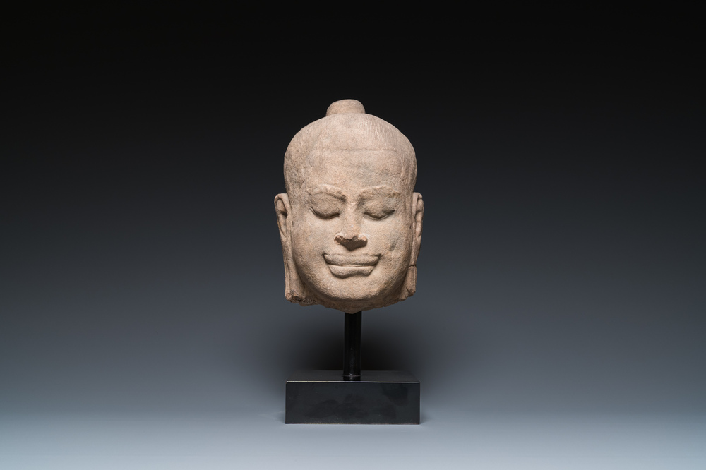 A Khmer stone head of Jayavarman VII in Bayon-style, Cambodia, probably 13th C.