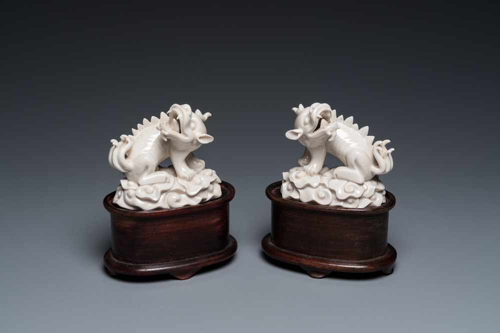 A pair of Chinese Dehua blanc de Chine models of xiezhi, probably Kangxi