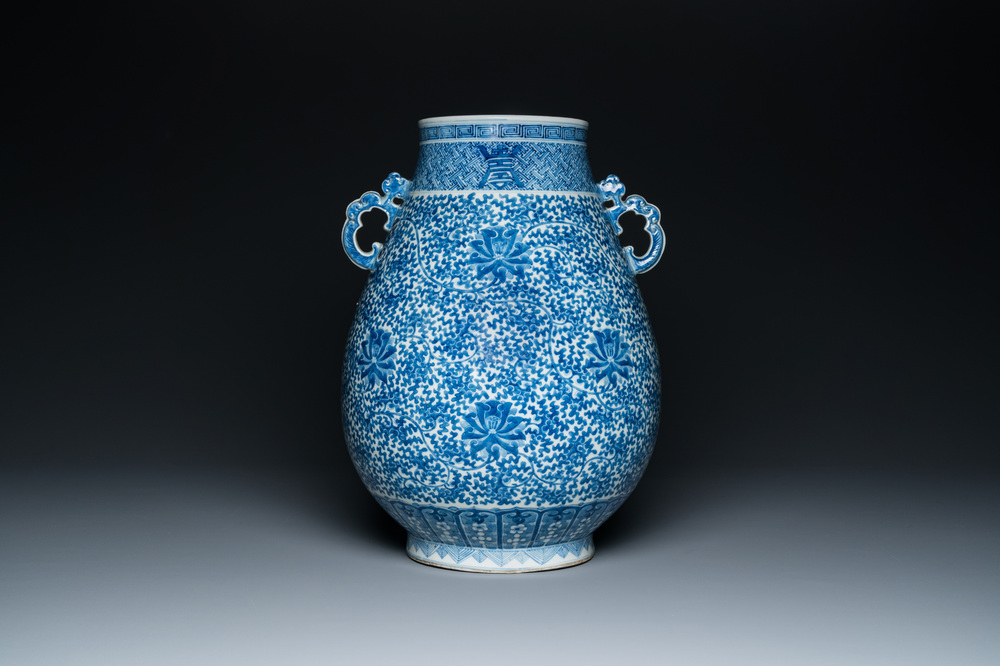 A Chinese blue and white 'hu' vase with lotus scrolls, Qianlong mark, 19th C.