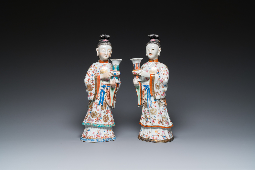 A pair of large Chinese famille rose candle holders in the shape of Mandarin court ladies, Qianlong