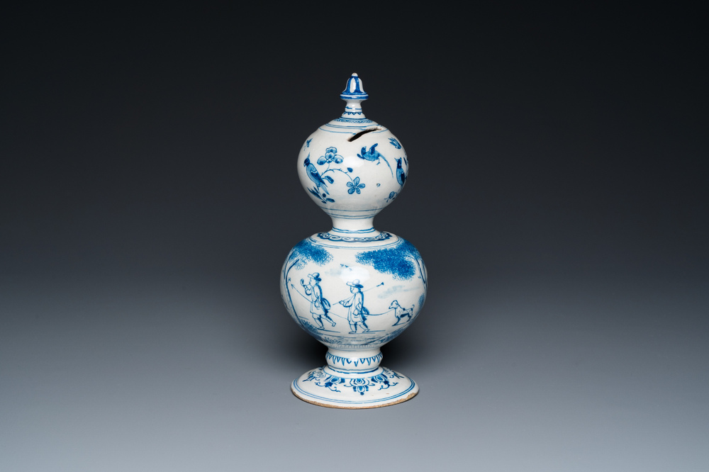 A Dutch Delft blue and white double gourd money bank with a deer hunt, dated 1732