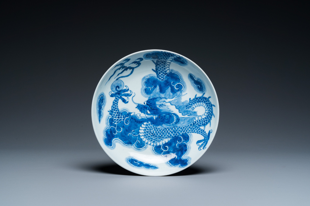 A Chinese blue and white plate with a dragon chasing the flaming pearl, Yongzheng mark and of the period