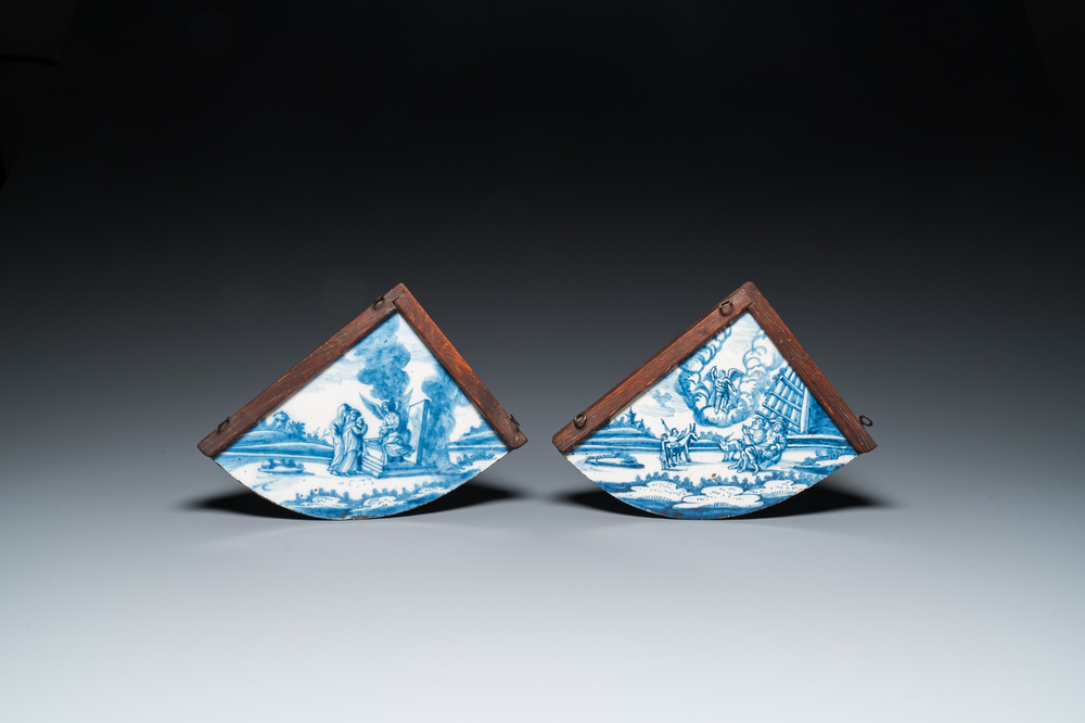 A pair of rare Dutch Delfware blue and white corner or quadrant tiles with biblical scenes, Amsterdam, 1st half 18th C.