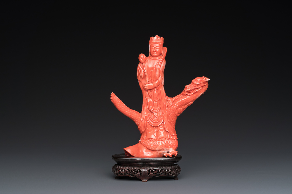 A Chinese red coral group of a standing prince on a dragon, 19/20th C.