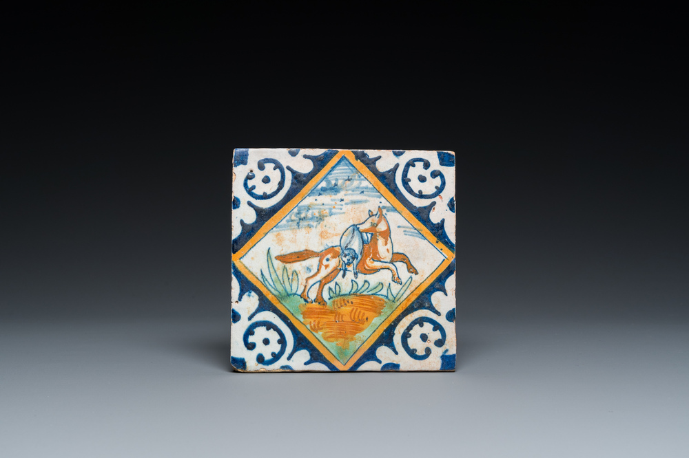 A polychrome Dutch maiolica tile with a fox and his prey, ca. 1600