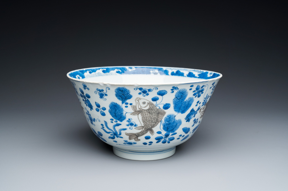A Chinese blue, white and copper-red 'carps' bowl, Kangxi