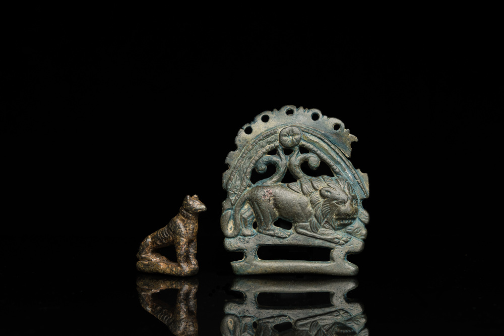 A Roman bronze model of a panther and a belt plate with a lion, ca. 2nd C.