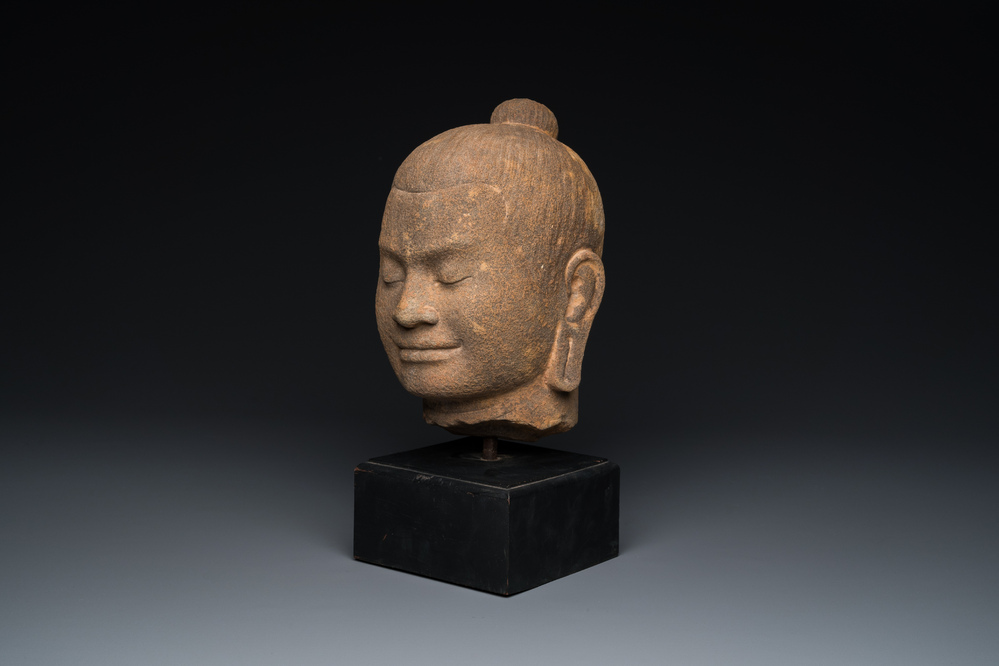 A Khmer stone head of Jayavarman VII in Bayon-style, Cambodia, probably 13th C.