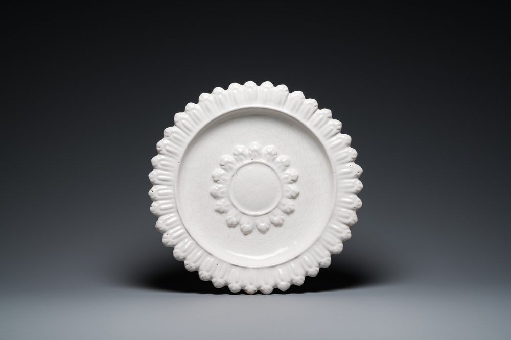 A large French white-glazed relief-decorated dish, Saint-Jean-du-D&eacute;sert, Marseille, France, 17th C.