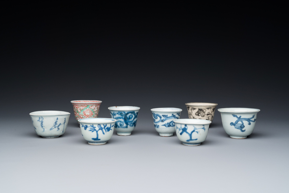 Eight Chinese mostly blue and white wine and tea cups, Ming