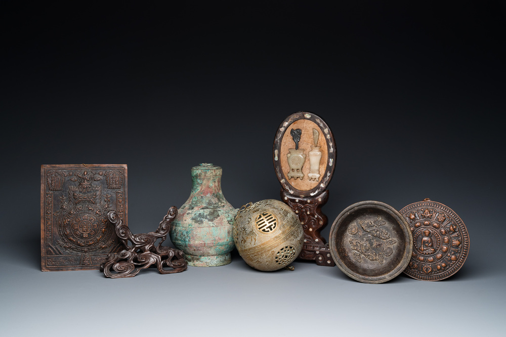 A varied collection of Chinese and Tibetan bronze, brass and wood objects, 19/20th C.