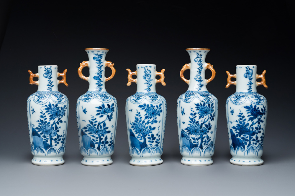 A Chinese blue and white garniture of five vases with floral design, Kangxi