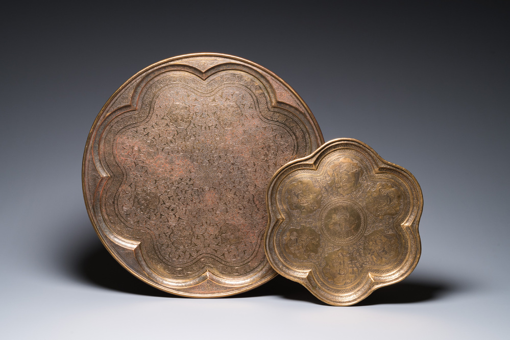Two large Qajar engraved brass dishes, one with the portrait of Shah Abbas, Persia, early 20th C.