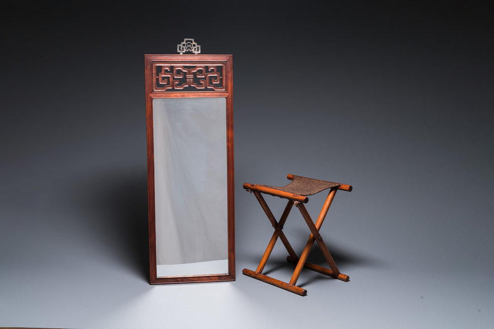 A Chinese wooden mirror and a foldable stool, 19/20th C.