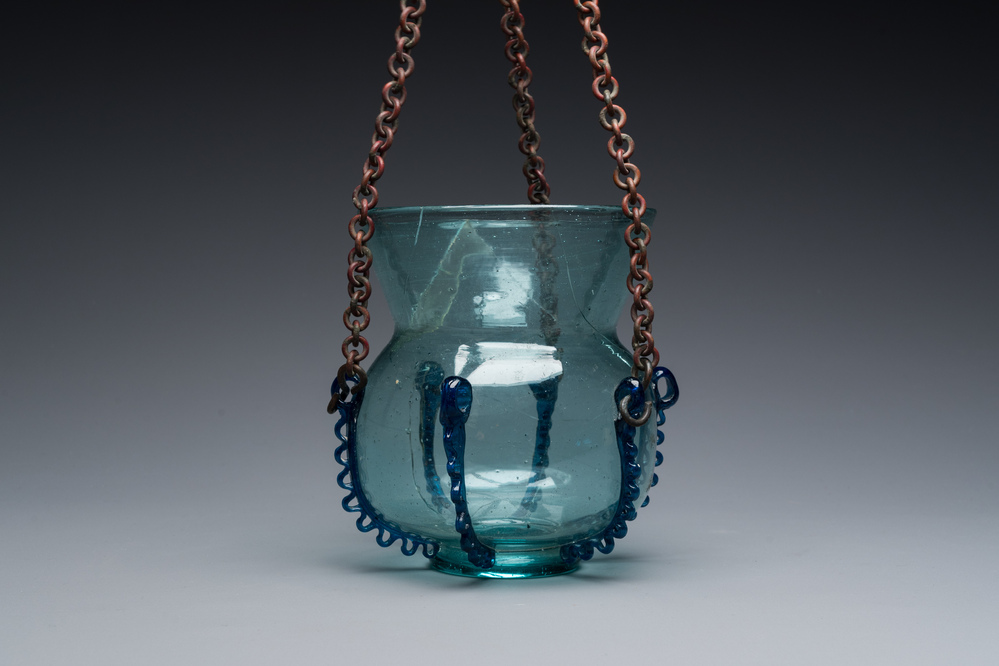 A light blue glass mosque lamp, Syria or Persia, 10th C.