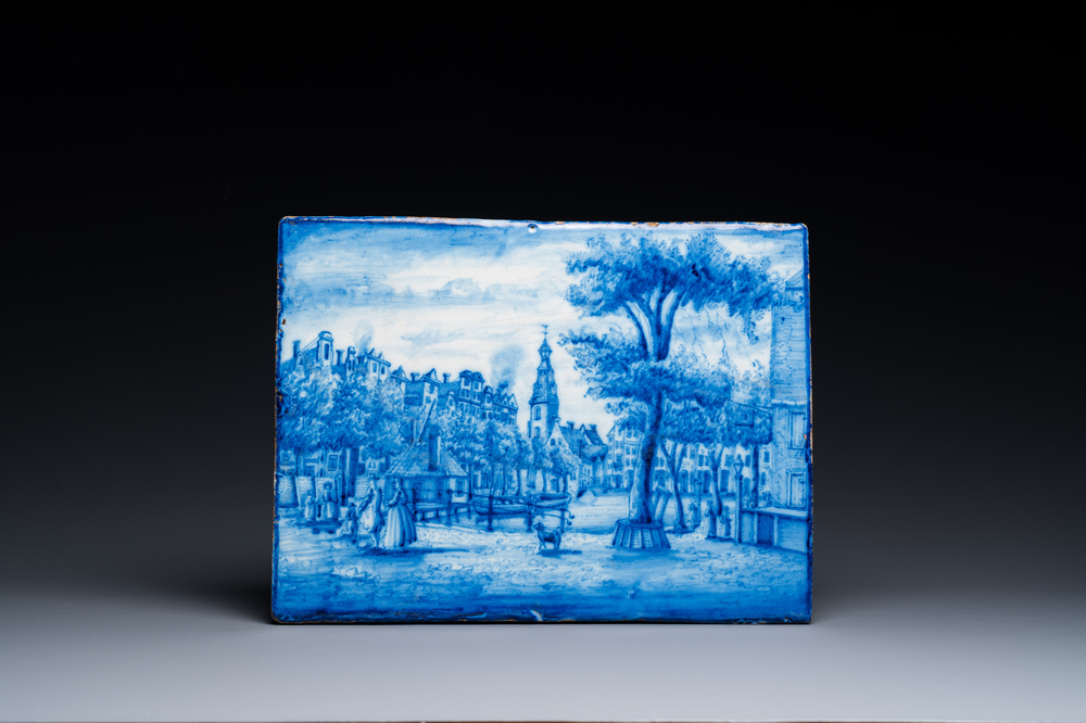 A Dutch blue and white Delft-style topographical plaque with figures on a bridge, probably Utrecht, 18/19th C.