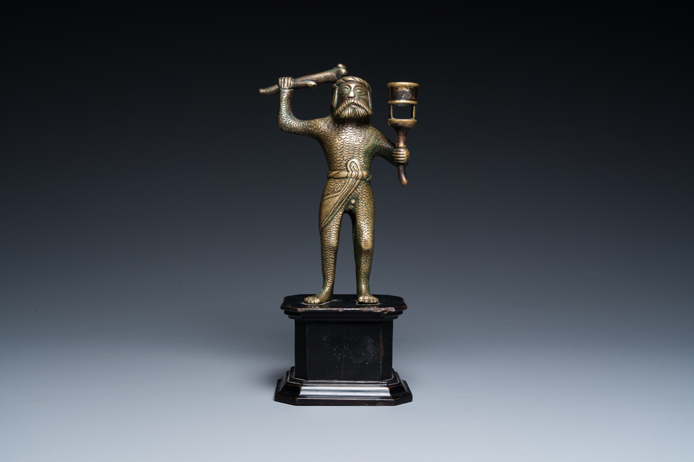 A rare bronze 'wild man' candlestick, Flanders or Germany, 15/16th C.