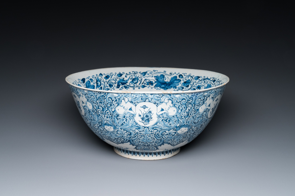 A very fine and rare Dutch Delft blue and white bowl with grotesques in the style of Daniel Marot, dated 1720