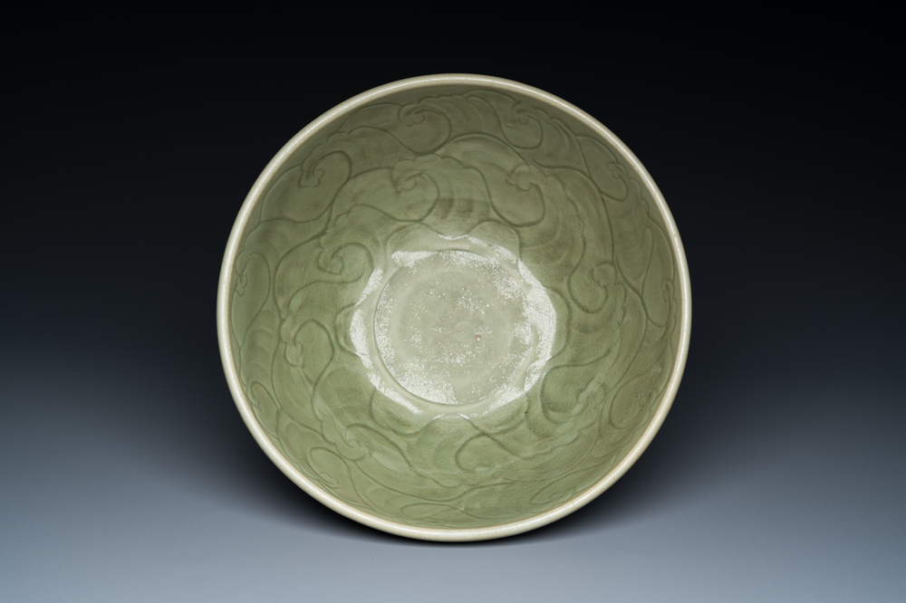 A large Chinese Longquan celadon bowl with underglaze design, Ming