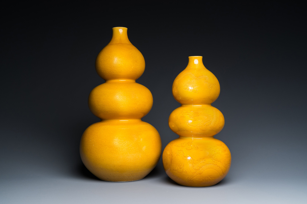 Two Chinese monochrome yellow-glazed triple gourd vases with incised designs of lotus scrolls and dragons, Longqing mark, 19th C.