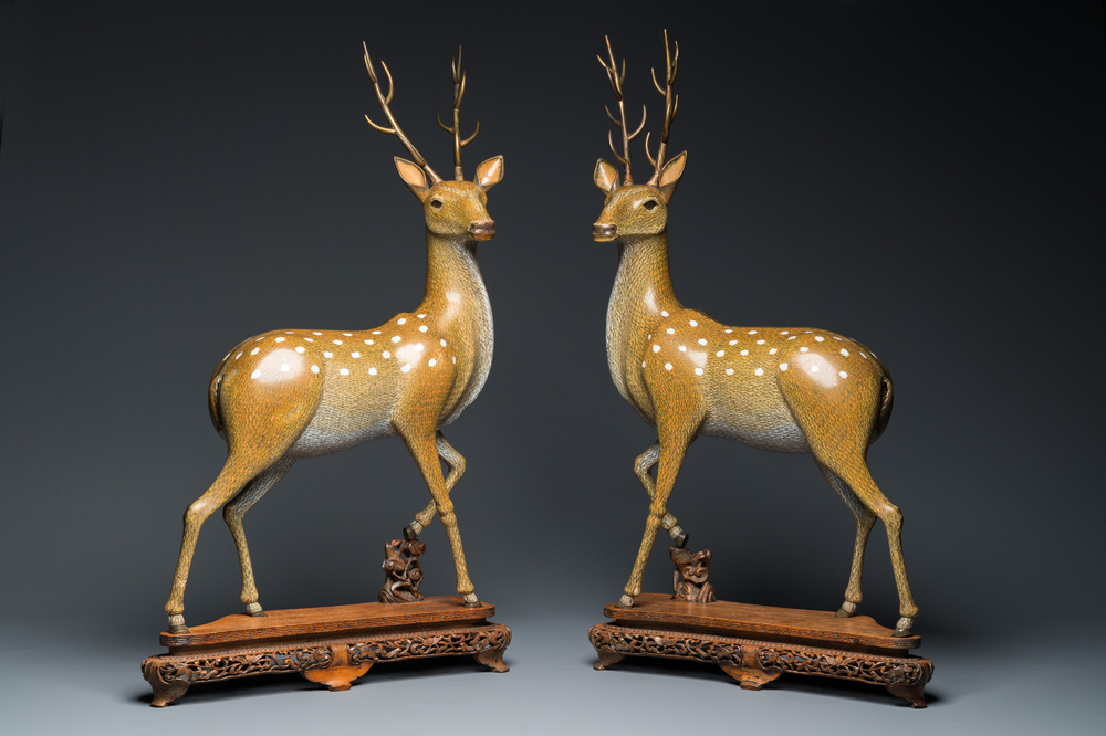 A very fine and large pair of Chinese cloisonn&eacute; models of deer on reticulated wooden stands, 19th C.