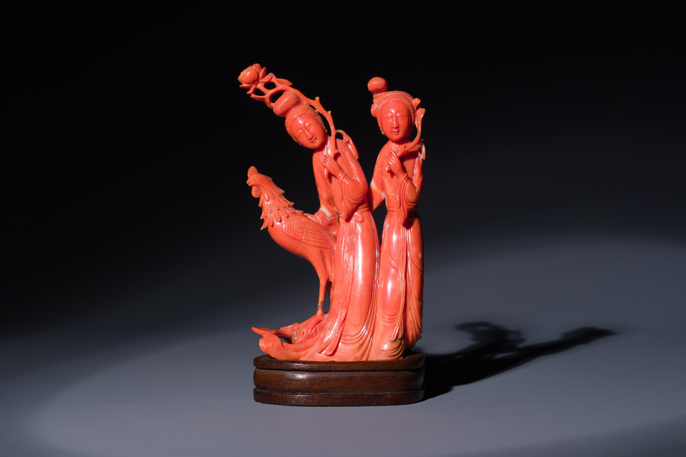 A Chinese red coral group of two ladies and a phoenix, 19/20th C.