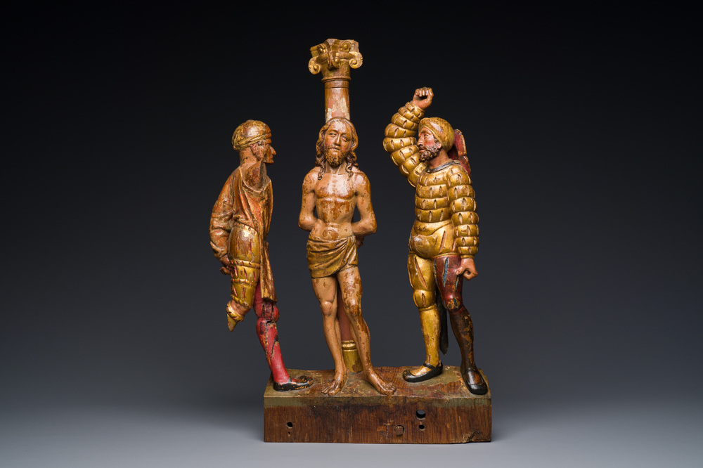 A Flemish polychromed and gilded wood retable fragment with 'The flagellation of Christ', probably Antwerp, early 16th C.