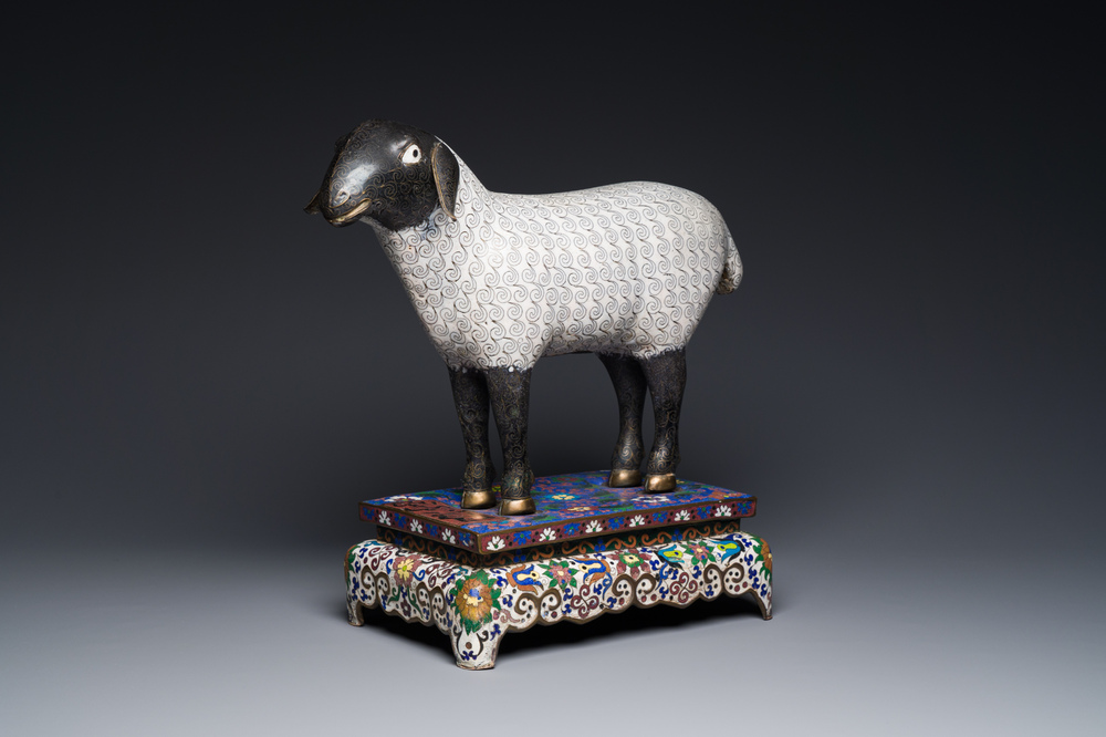 A Chinese cloisonn&eacute; model of a sheep standing on a rectangular base with Arabic inscription, Qing