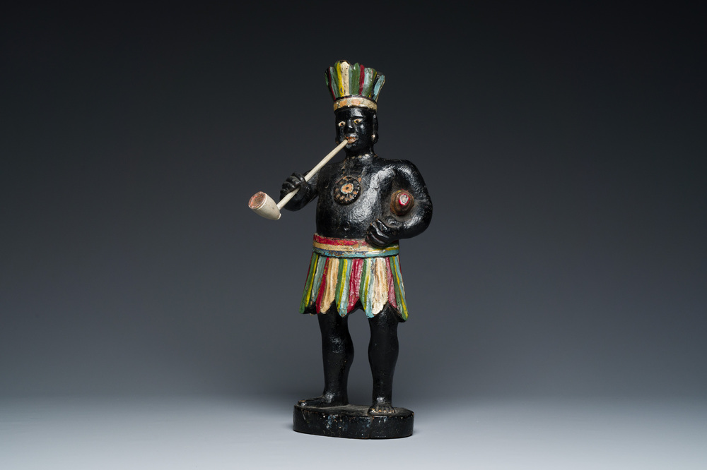 An English polychromed wood sculpture of a pipe-smoking Indian from a tobacco store, 18th C.
