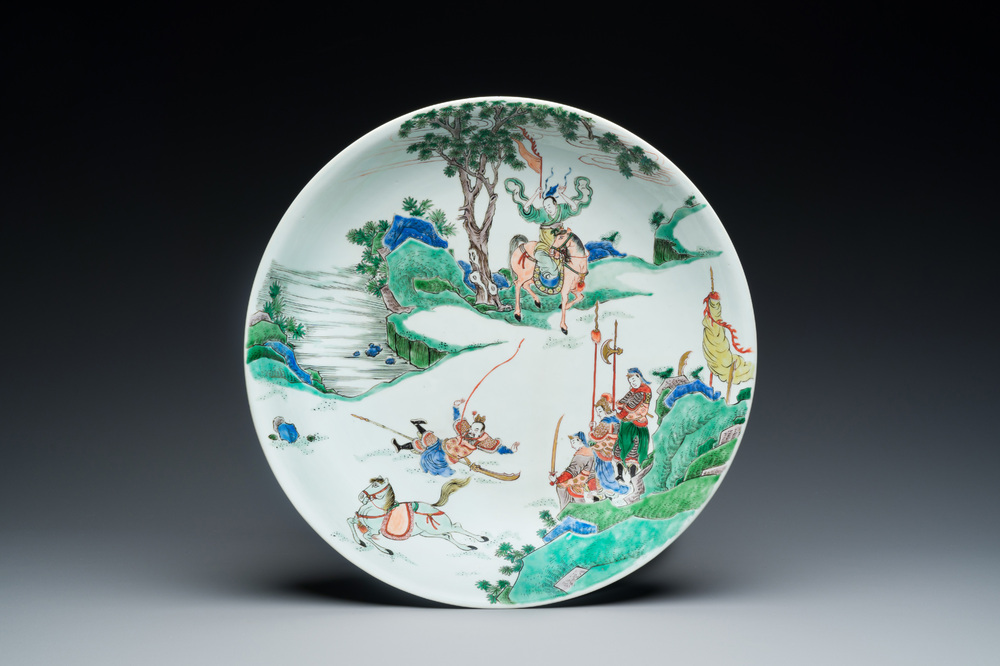 A Chinese famille verte dish with a rider falling from his horse, Chenghua mark, Kangxi