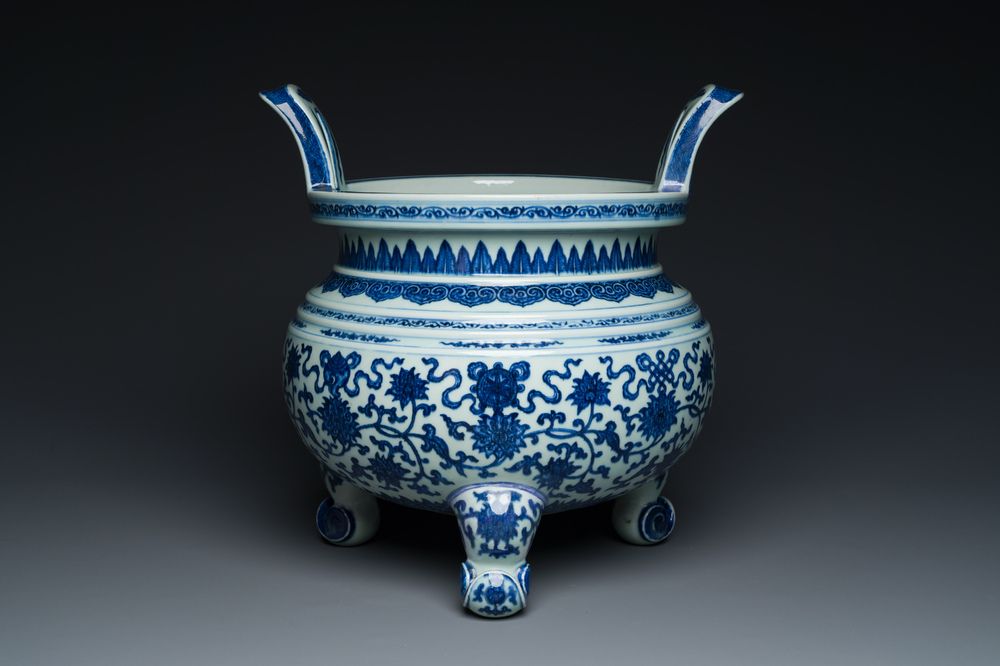 A large Chinese blue and white 'bajixiang' tripod censer with lotus scrolls, Qianlong