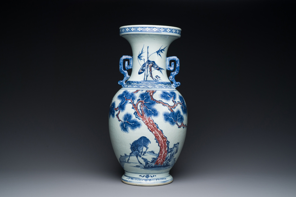 A Chinese blue, white and copper-red vase with two deer near a pine tree, Qianlong