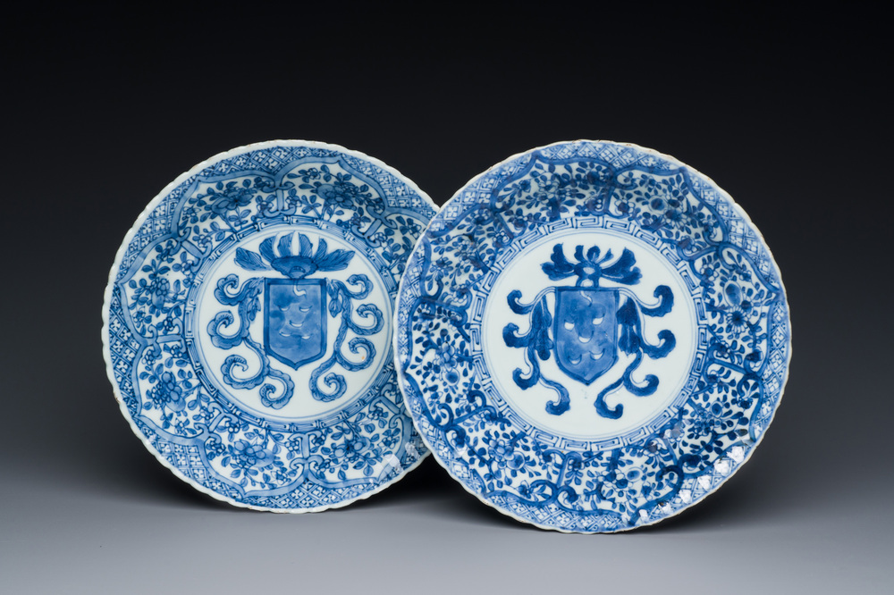 A pair of Chinese blue and white plates with the arms of the De Pinto family for the Portuguese market, Kangxi