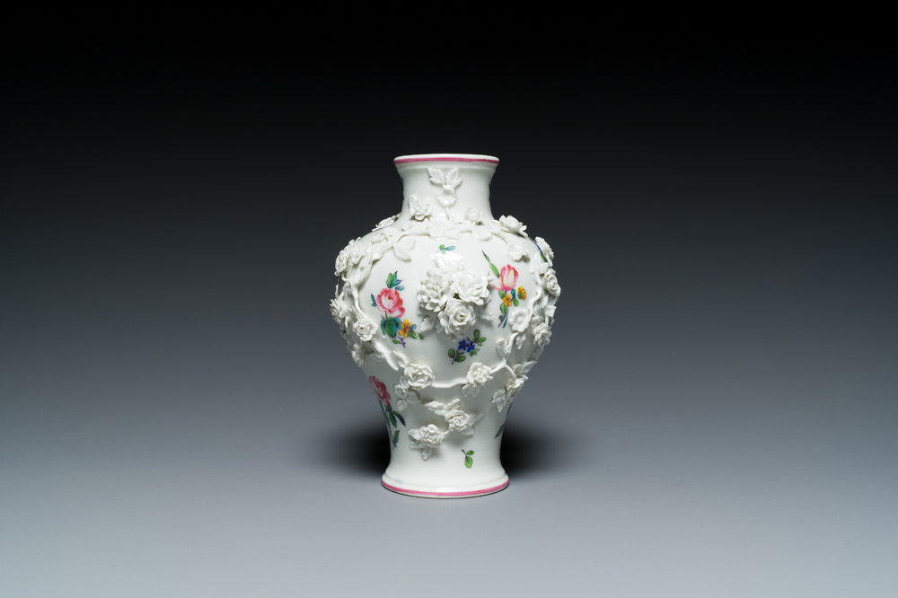 A Mennecy vase with applied floral design, France, DV mark, 18th C.