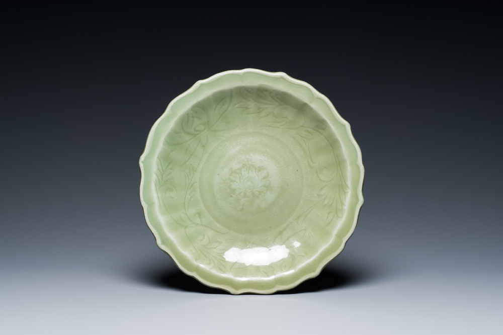 A Chinese Longquan celadon lotus-form dish with underglaze floral design, Ming
