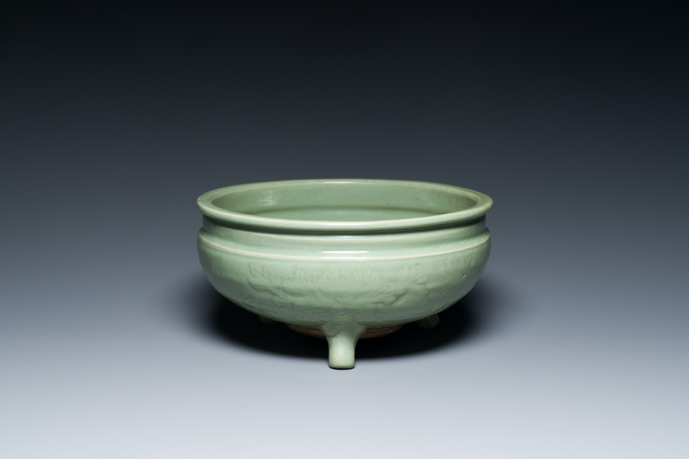 A Chinese Longquan celadon tripod censer with underglaze decoration, Ming