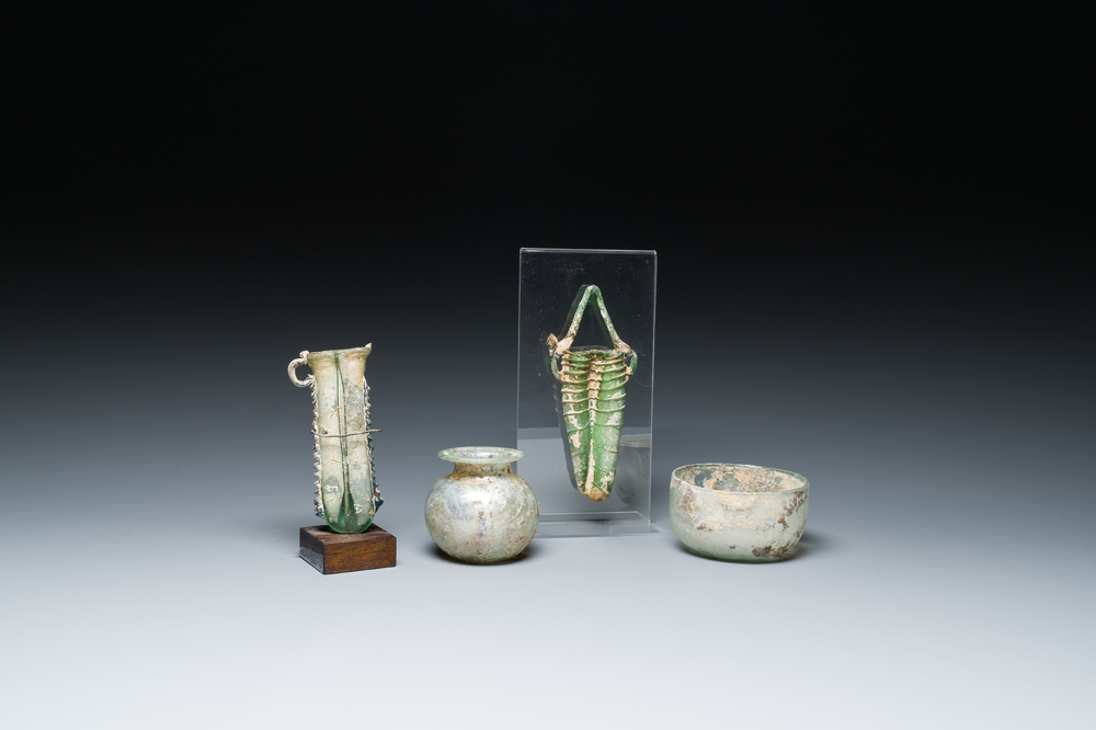 Two Roman glass balsamariums, a flask and a bowl, 2nd/4th C.