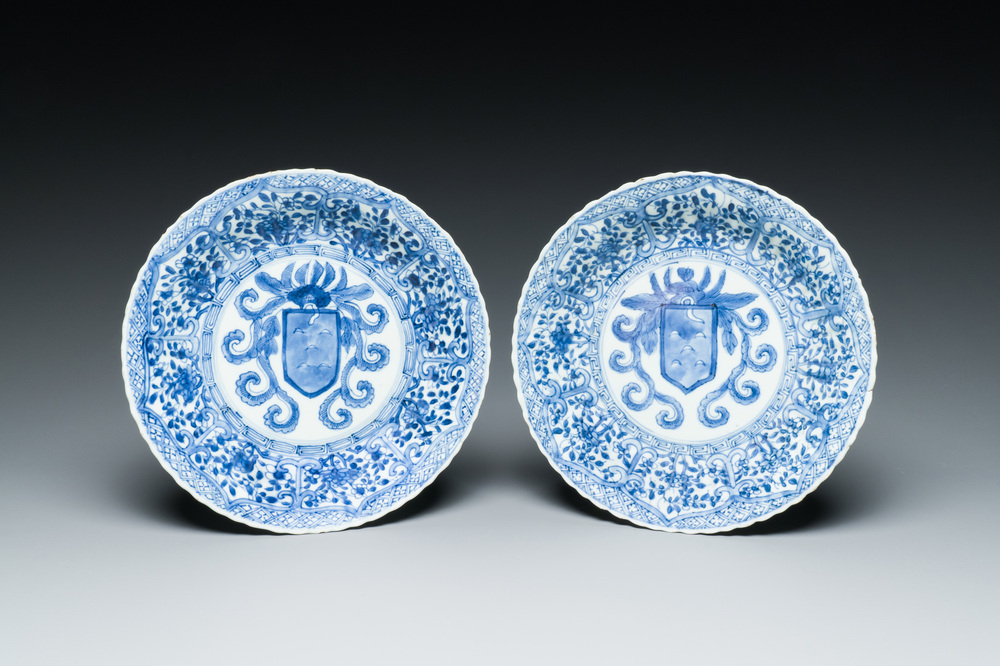 A pair of Chinese blue and white plates with the arms of the De Pinto family for the Portuguese market, Kangxi