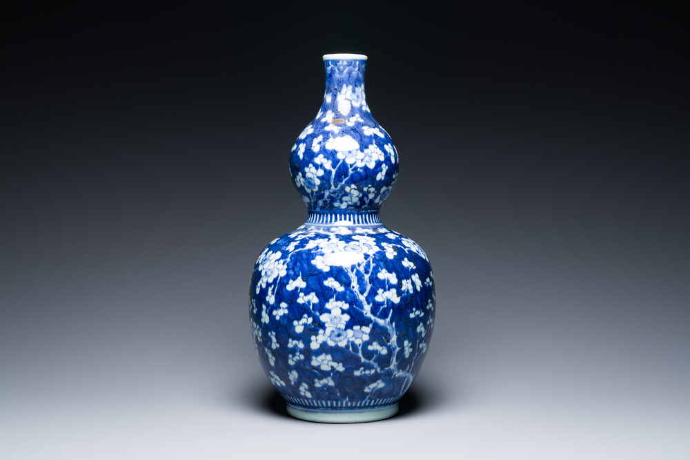 A Chinese blue and white double gourd 'prunus on cracked ice' vase, 18th C.