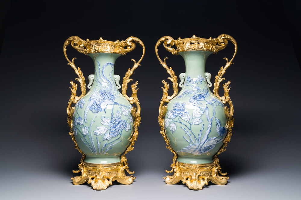 A pair of Chinese blue and white celadon vases with gilt bronze mounts, 19th C.
