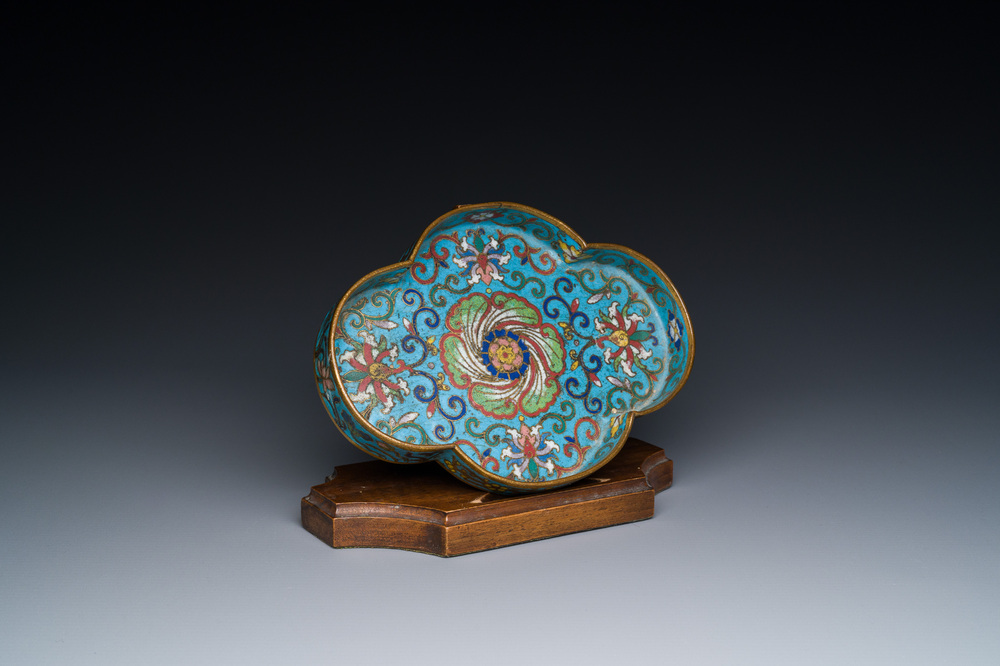 A Chinese quadrifoil cloisonn&eacute; dish with floral design on wooden stand, Yongzheng