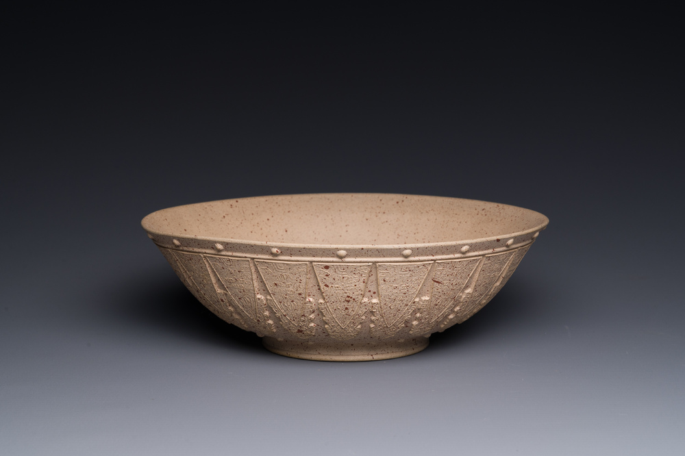 A large Chinese Yixing stoneware bowl with relief design, Qianlong mark, 18/19th C.