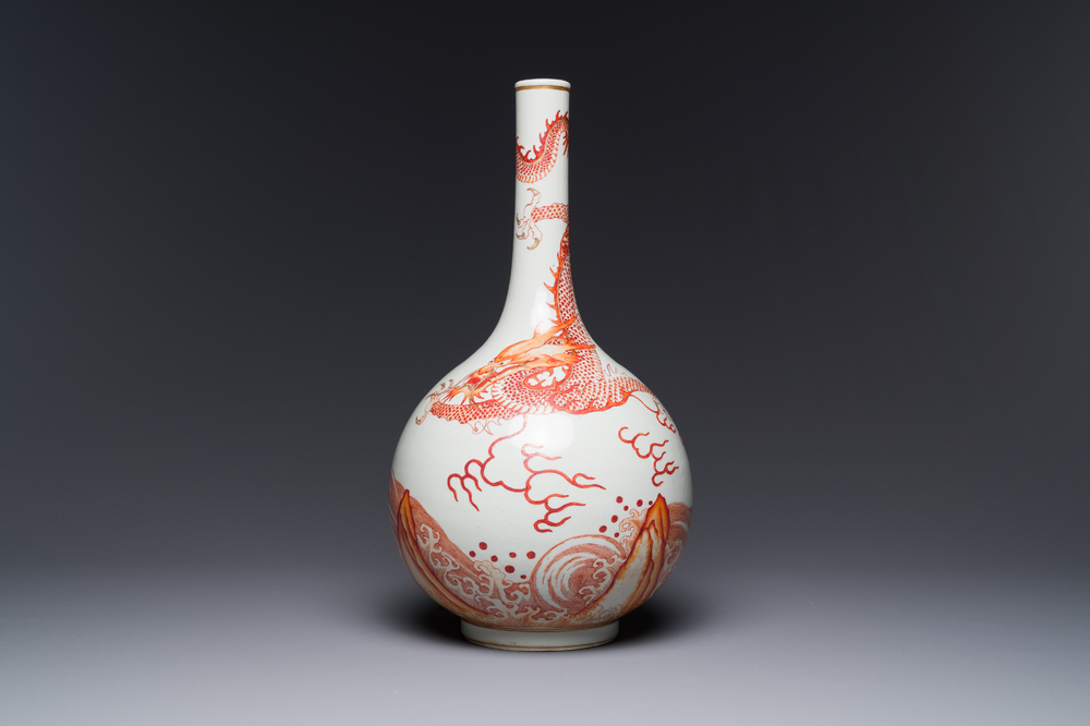 A Chinese iron-red-decorated and gilt 'dragon and carp' bottle vase, 19/20th C.