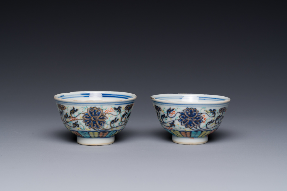 A pair of Chinese doucai 'lotus scroll' cups, Guangxu mark and of the period