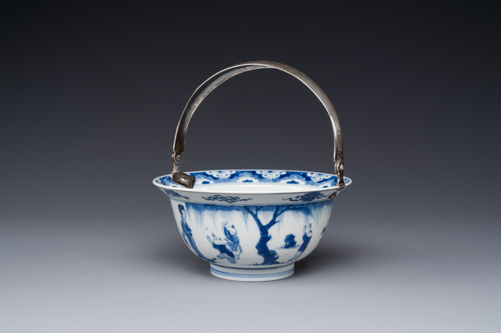 A Chinese blue and white bowl depicting playing boys and ladies with a mounted silver handle, Chenghua mark, Kangxi